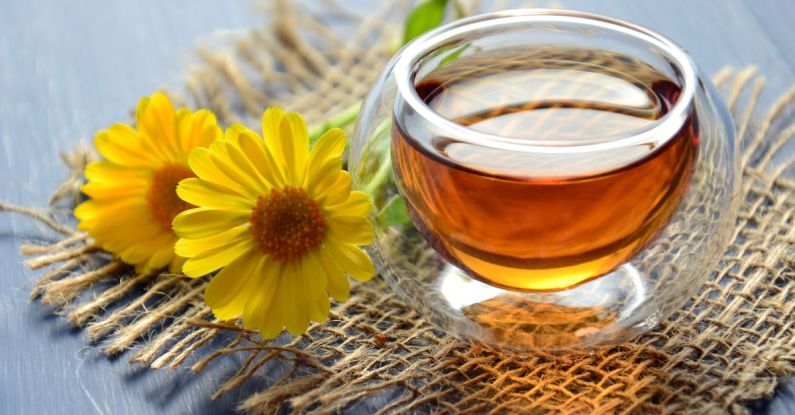 Herbal Tea - Clear Glass Bowl Beside Yellow Flower