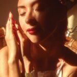 Meditation Beauty - Woman Sitting on a Rattan Armchair, in a Light and Shadow