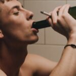 Alcohol Skin - Topless Man Drinking from Wine Bottle