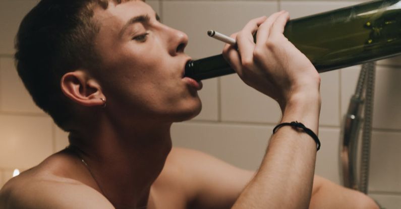 Alcohol Skin - Topless Man Drinking from Wine Bottle