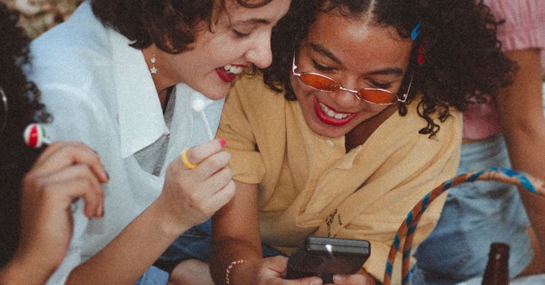 Vintage Fashion - Shallow Focus Photo of Woman Using Game boy