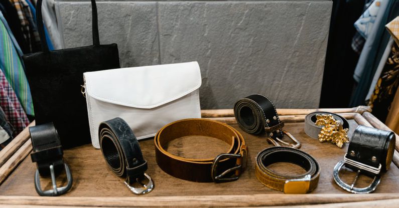 Belts Fashion - Assorted Black Leather Belts on Brown Wood Table