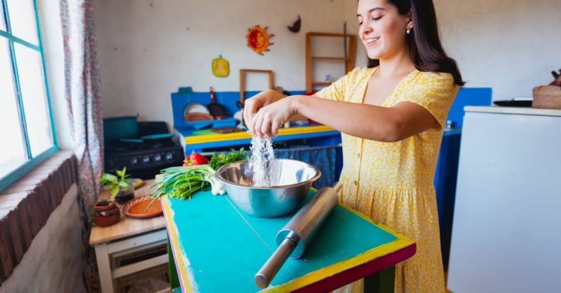 Mixing Prints - Woman in Yellow Dress Mixing Flour in Stainless Steel Bowl