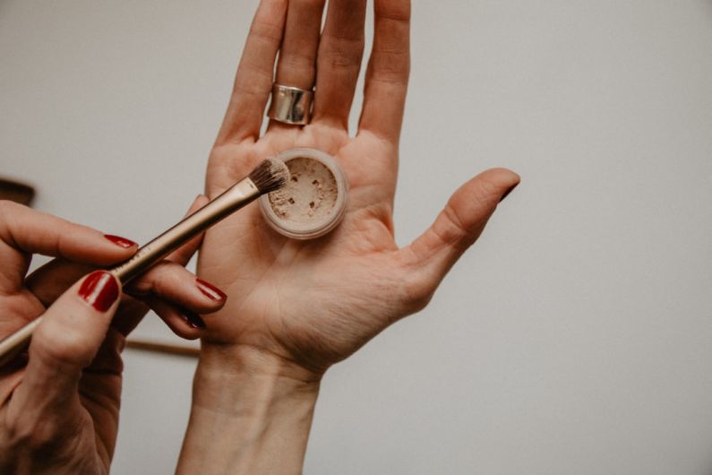 Natural Makeup - person holding silver round analog watch