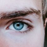 Eyebrows Shaping - man's blue left eye