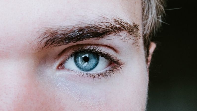 Eyebrows Shaping - man's blue left eye