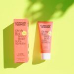 Sunscreen Face - pink and white plastic tube bottle