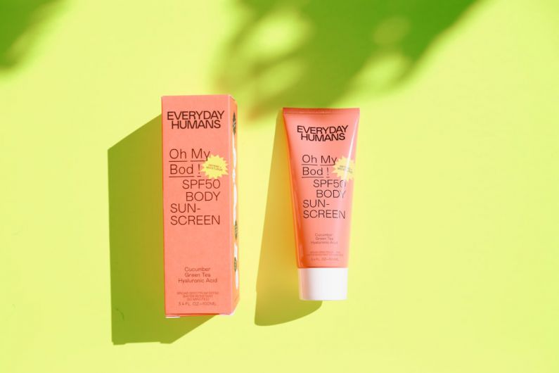 Sunscreen Face - pink and white plastic tube bottle