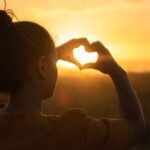 Hair Porosity - Woman Sitting While Showing Heart Sign Hands