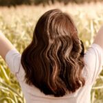 Hair Growth - Woman on Grass Field Lifting Hands
