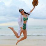 Beach Waves Hair - Woman Jumping on Seashore and Holding Hat