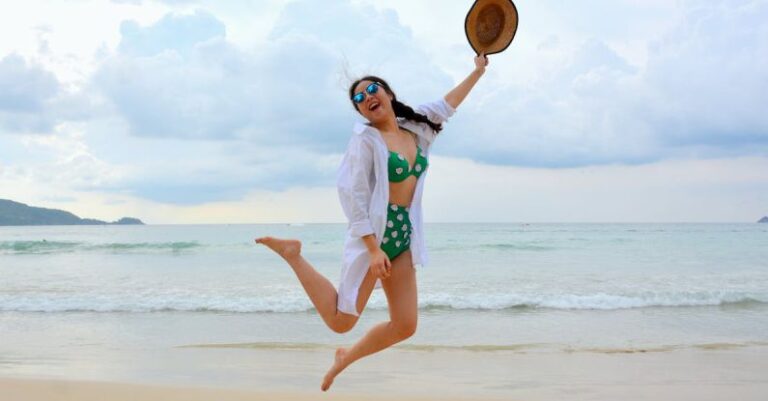 Beach Waves Hair - Woman Jumping on Seashore and Holding Hat