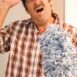 Cleaning Tools - Man in Blue and White Plaid Button Up Shirt Holding Black Cap