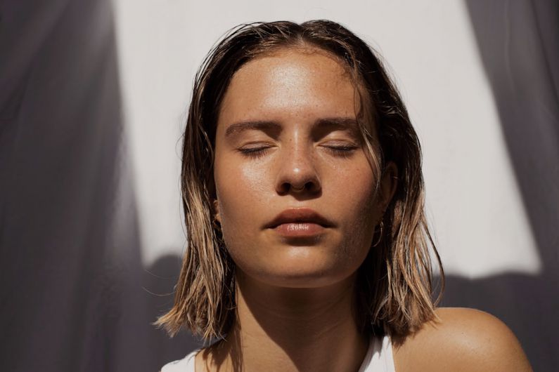 Skincare Routine - woman in white tank top